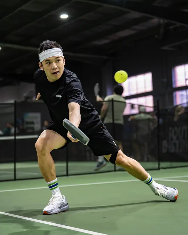 Full-stretch backhand — Pickleholic Doubles Series 2026 Winter Edition